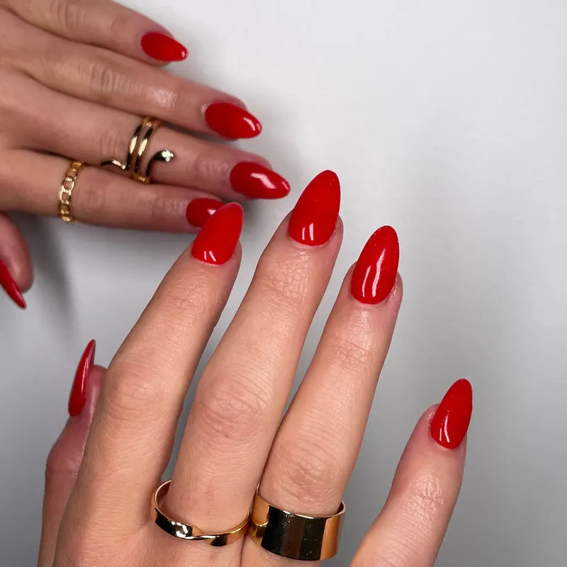 Glossy red almond nails