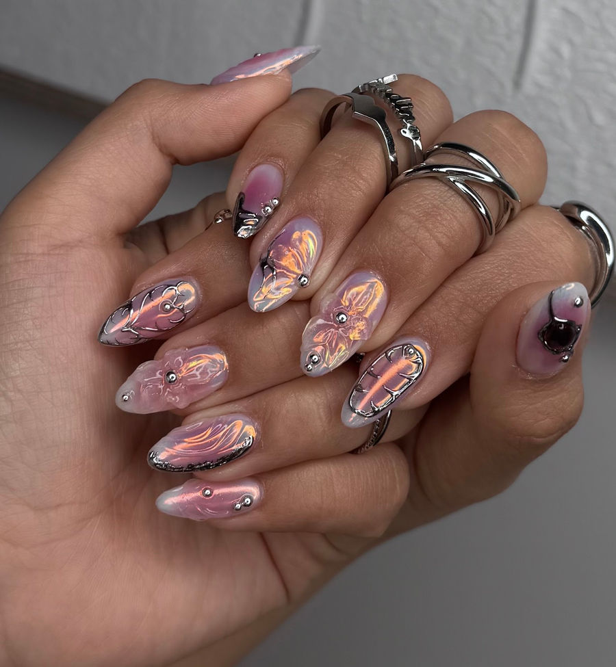 Pink chrome nail art with gems