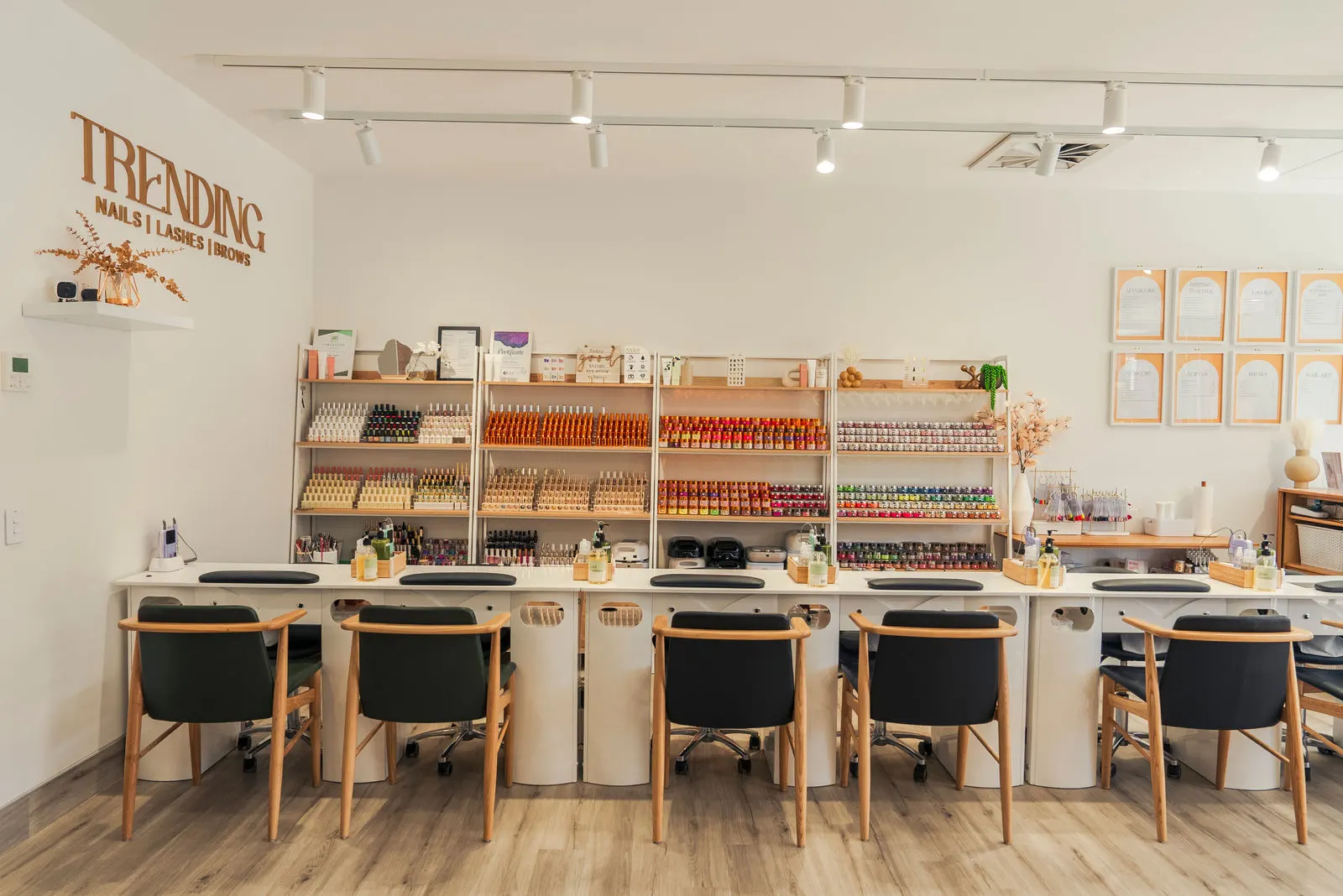 Manicure stations in front of the polish wall